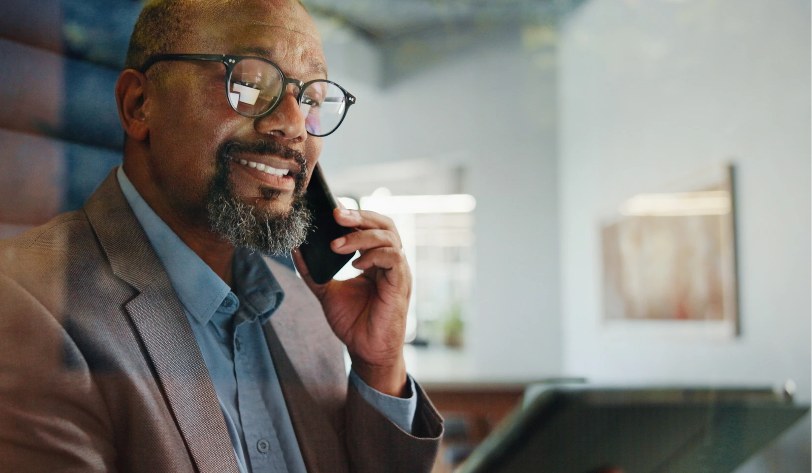 Man on a phone call about brand imagery and visual marketing