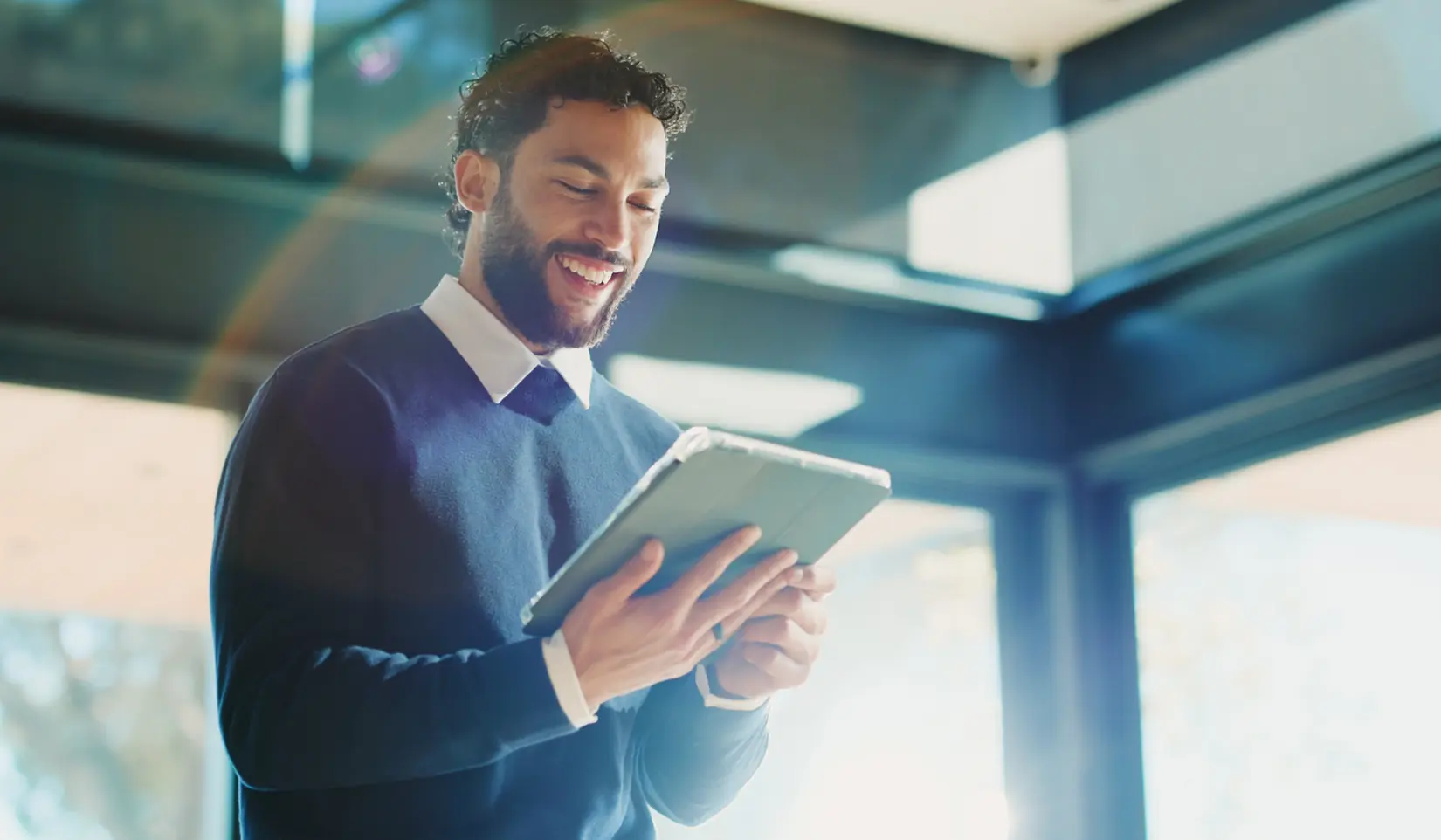 Professional man reviewing B2B content on a tablet device