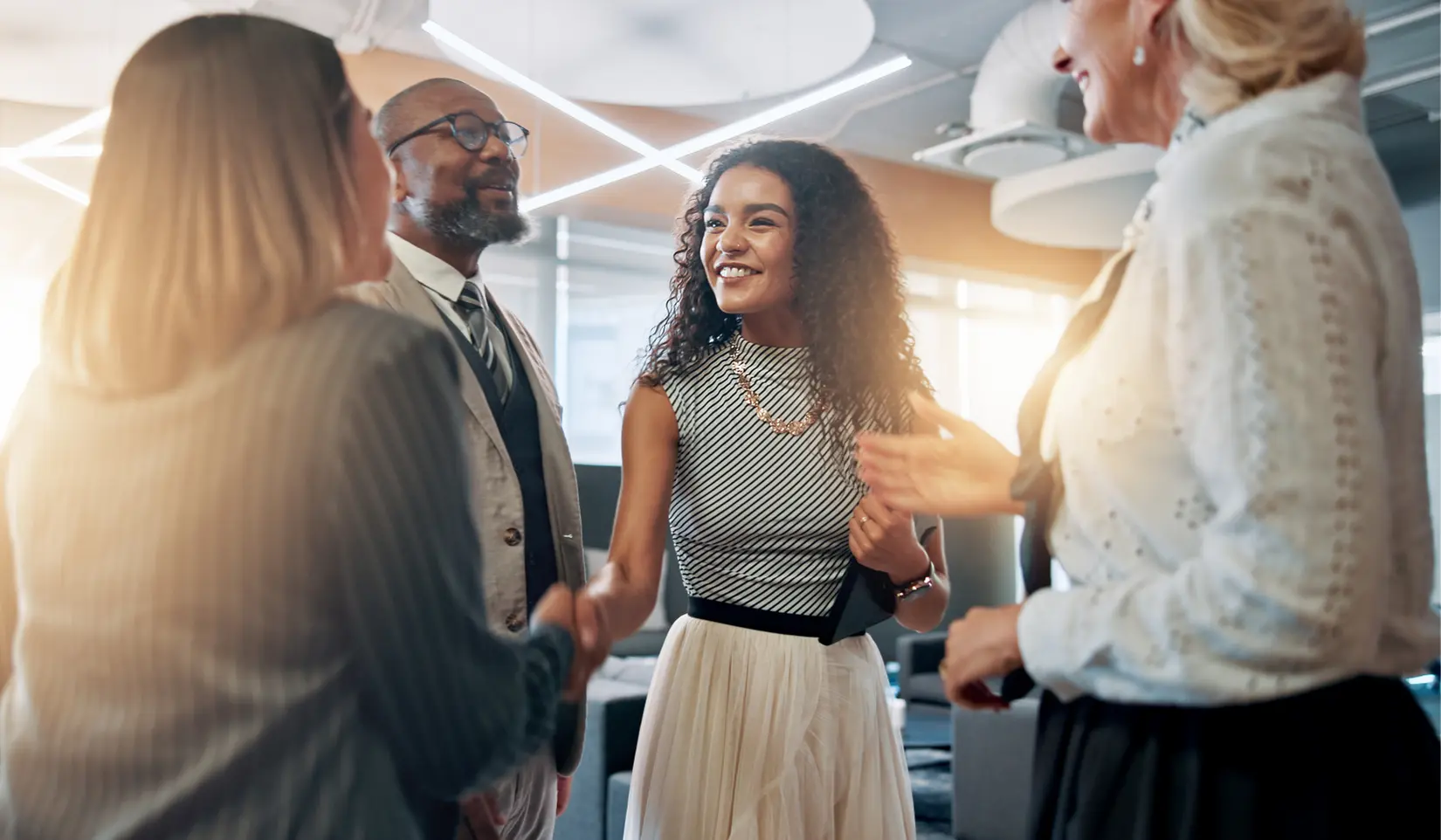 Marketing professionals meeting to discuss B2B review collection strategies