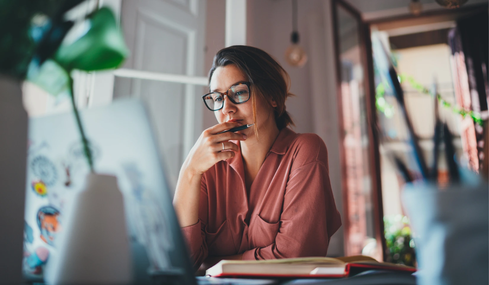 Marketer planning B2B and B2C content on her laptop
